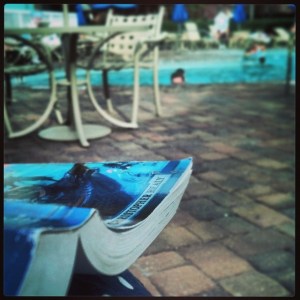Reading 'The Hero's Guide to Being an Outlaw' poolside on my honeymoon to Walt Disney World earlier this year. 